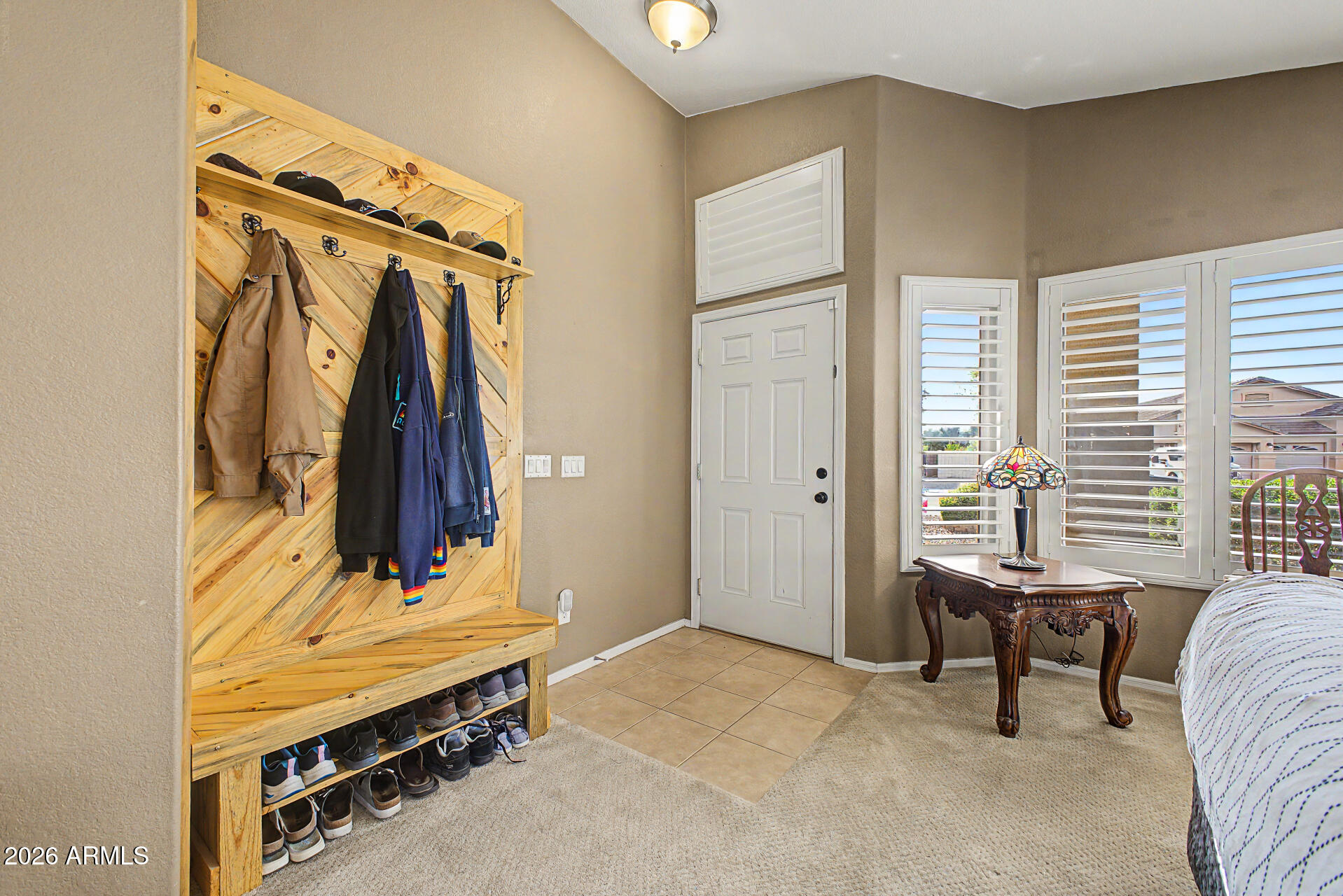 3425 South Loback Lane Gilbert, AZ 85297 - Photo 11 of 52 a view of walk in closet with clothes and shoes