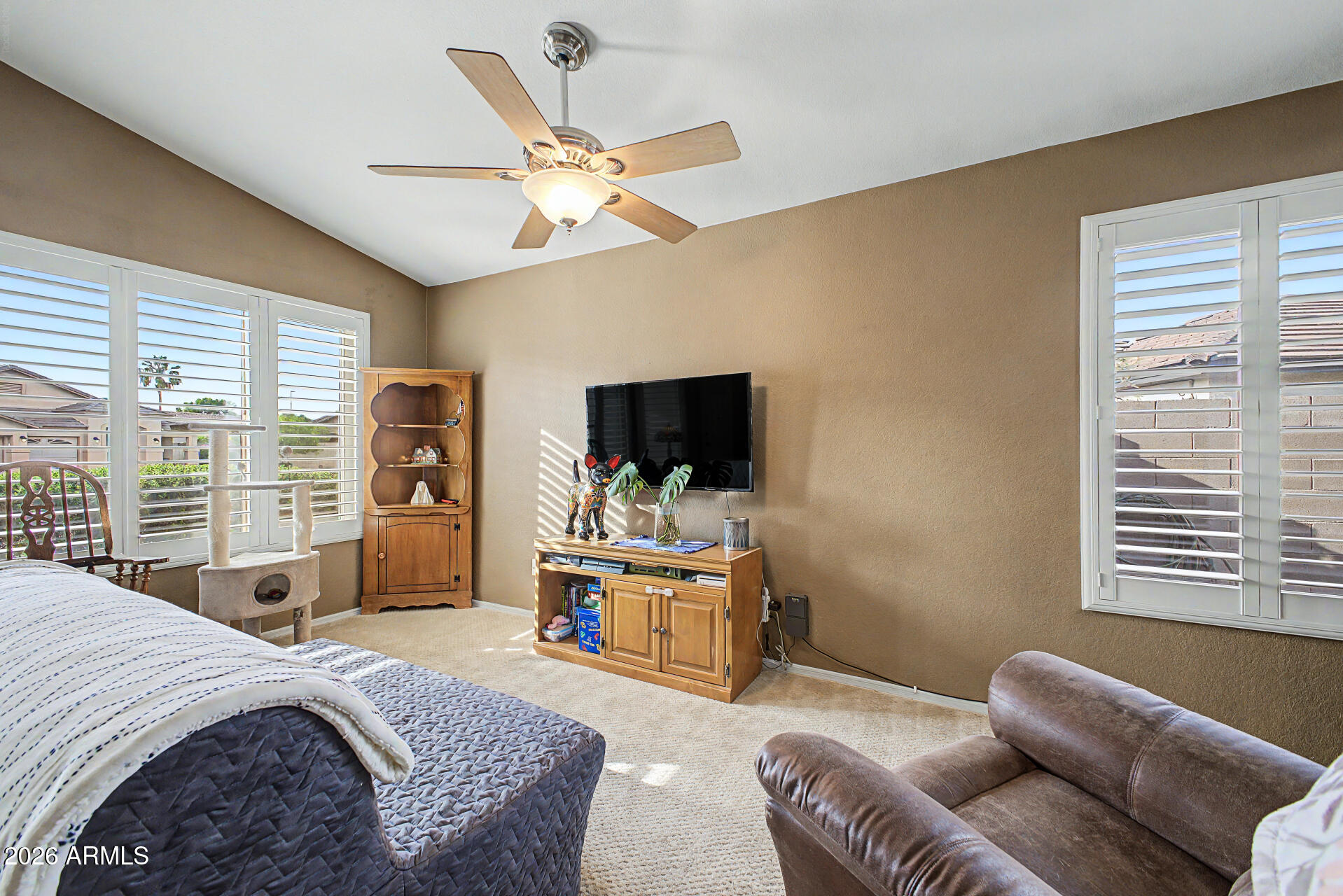 3425 South Loback Lane Gilbert, AZ 85297 - Photo 12 of 52 a bedroom with a bed and wooden floor