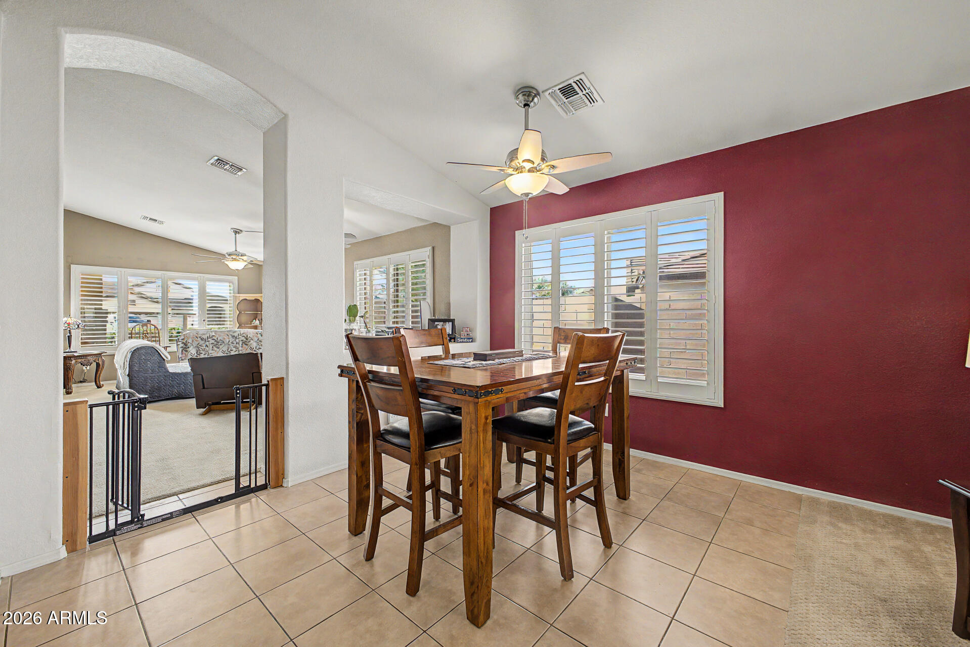 3425 South Loback Lane Gilbert, AZ 85297 - Photo 14 of 52 a view of a dining room with furniture and a chandelier