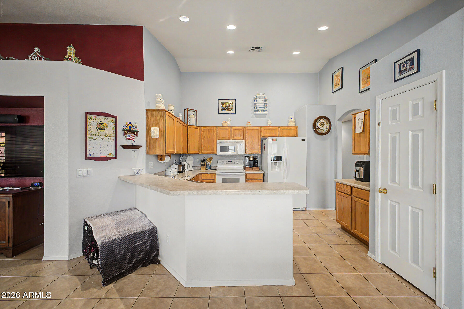 3425 South Loback Lane Gilbert, AZ 85297 - Photo 15 of 52 a kitchen with stainless steel appliances granite countertop a refrigerator and a stove