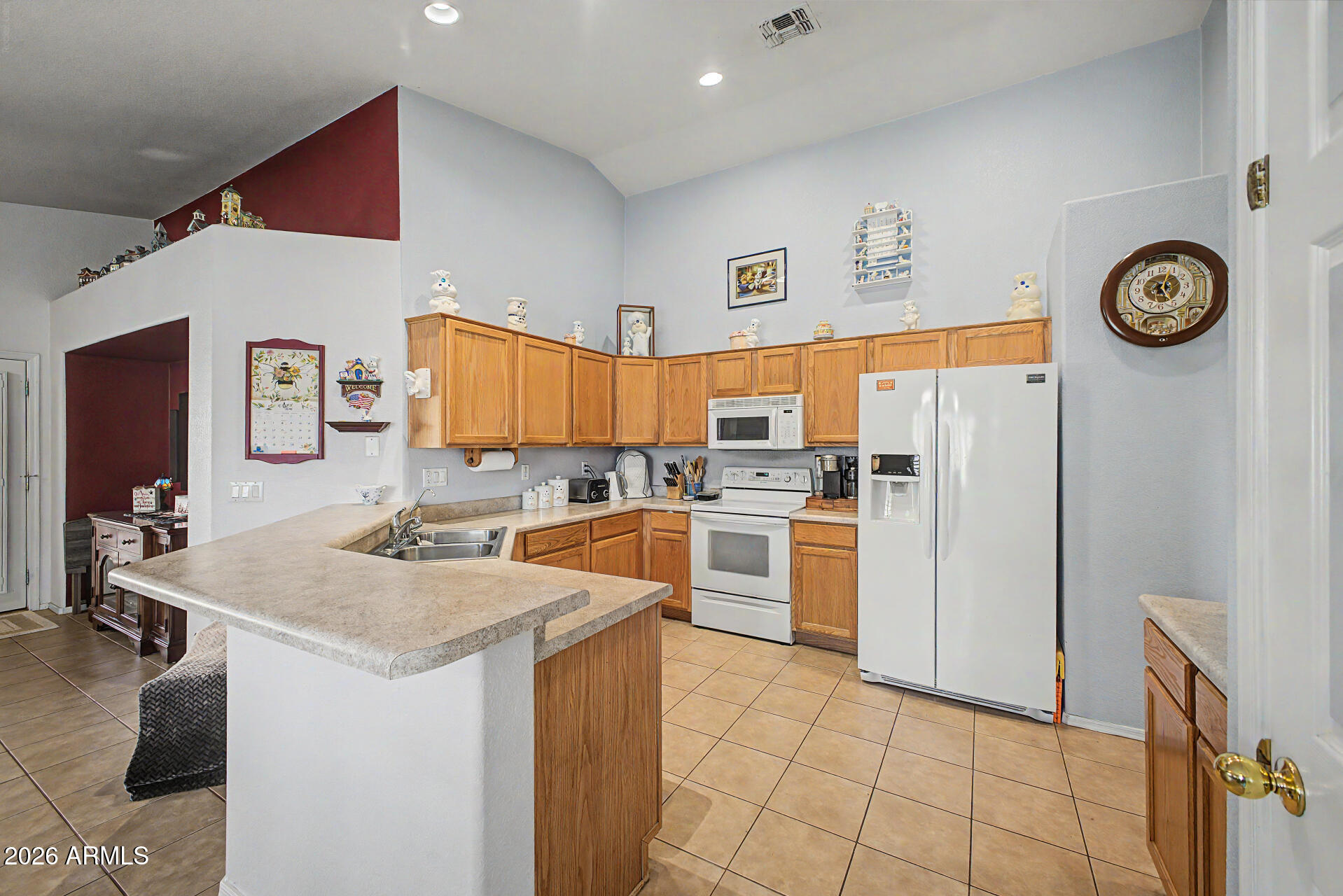 3425 South Loback Lane Gilbert, AZ 85297 - Photo 16 of 52 a kitchen with a refrigerator and a stove