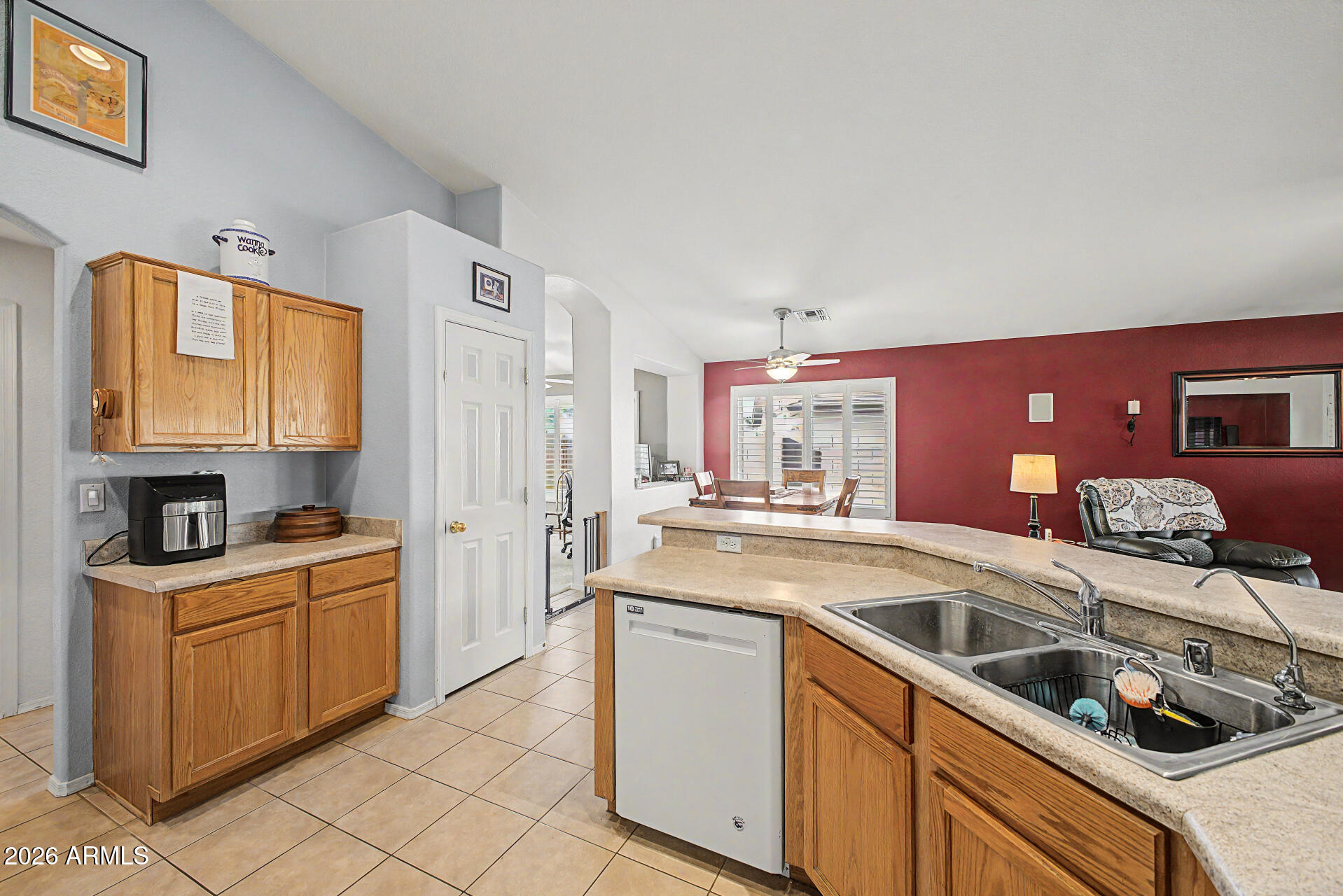 3425 South Loback Lane Gilbert, AZ 85297 - Photo 17 of 52 a kitchen that has a sink and a stove