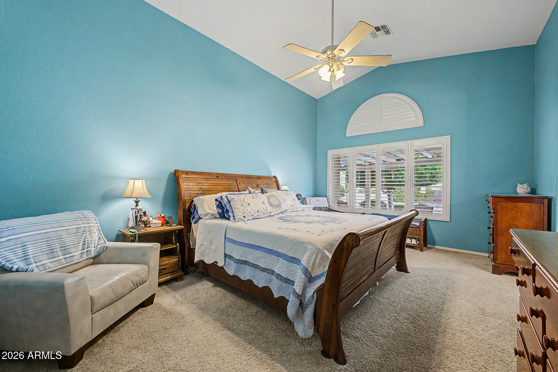 3425 South Loback Lane Gilbert, AZ 85297 - Photo 18 of 52 a bedroom with bed and a chandelier