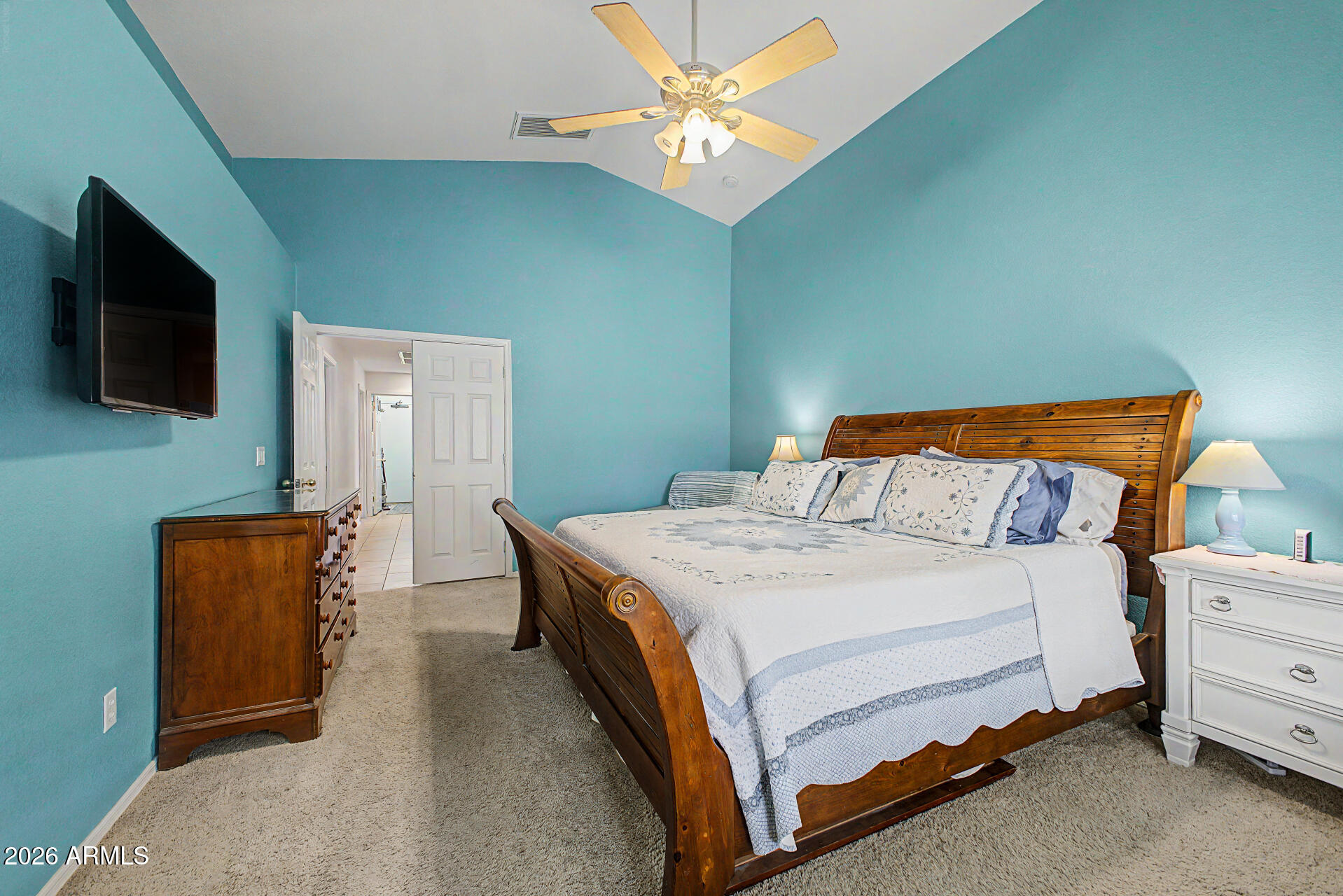 3425 South Loback Lane Gilbert, AZ 85297 - Photo 19 of 52 a bedroom with a bed and a flat screen tv