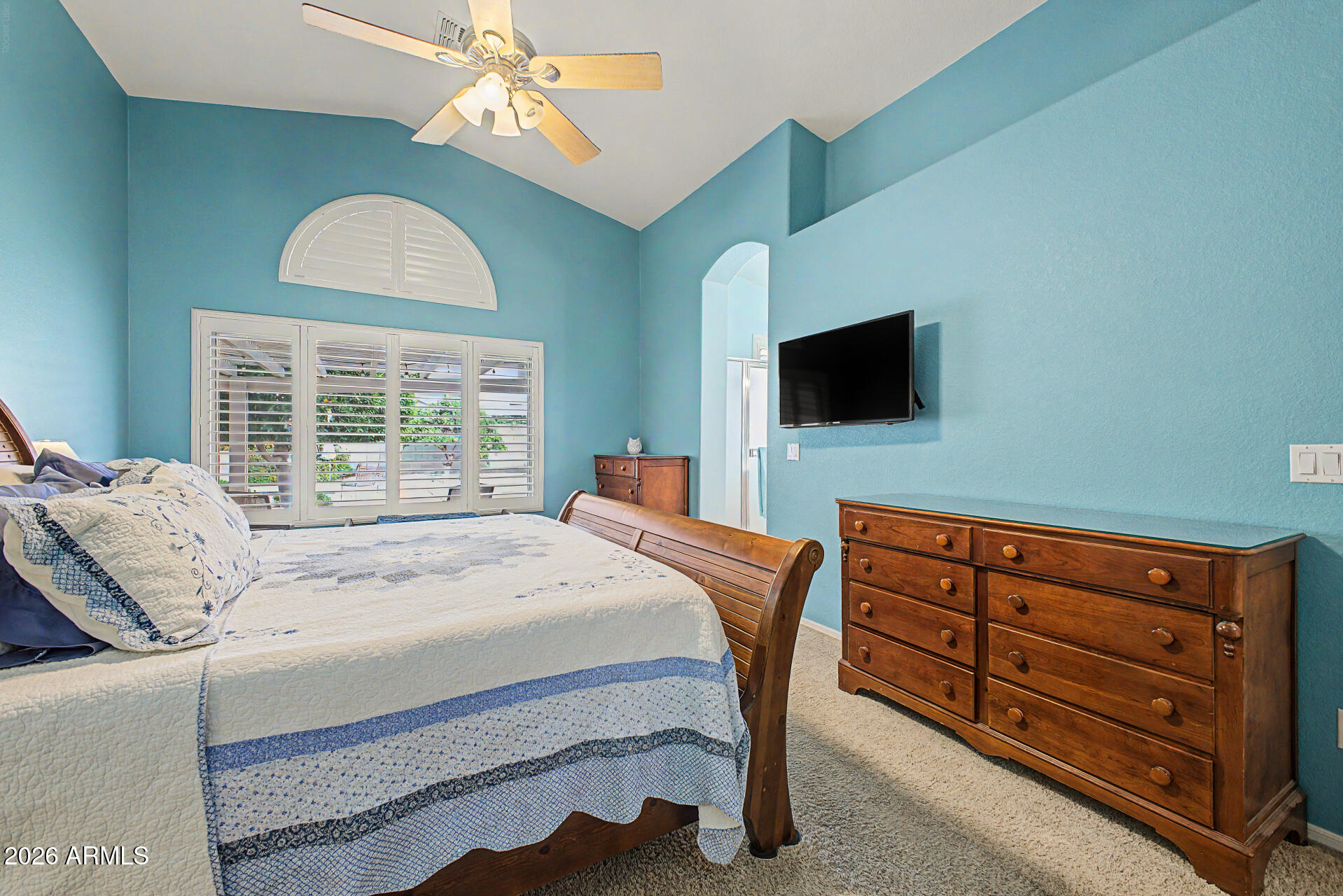 3425 South Loback Lane Gilbert, AZ 85297 - Photo 20 of 52 a bedroom with a bed and a flat screen tv