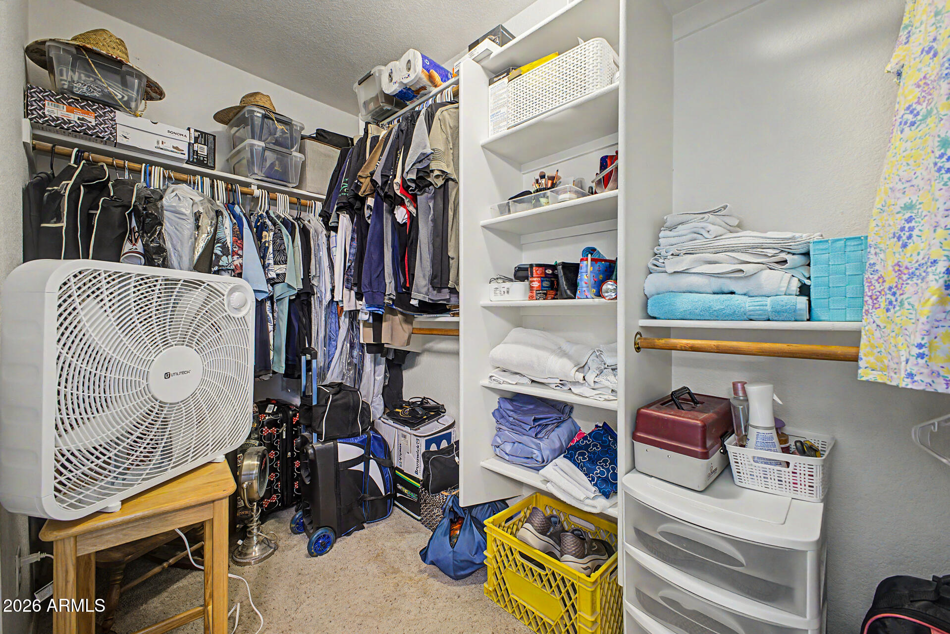 3425 South Loback Lane Gilbert, AZ 85297 - Photo 24 of 52 a view of walk in closet with clothes and shoes