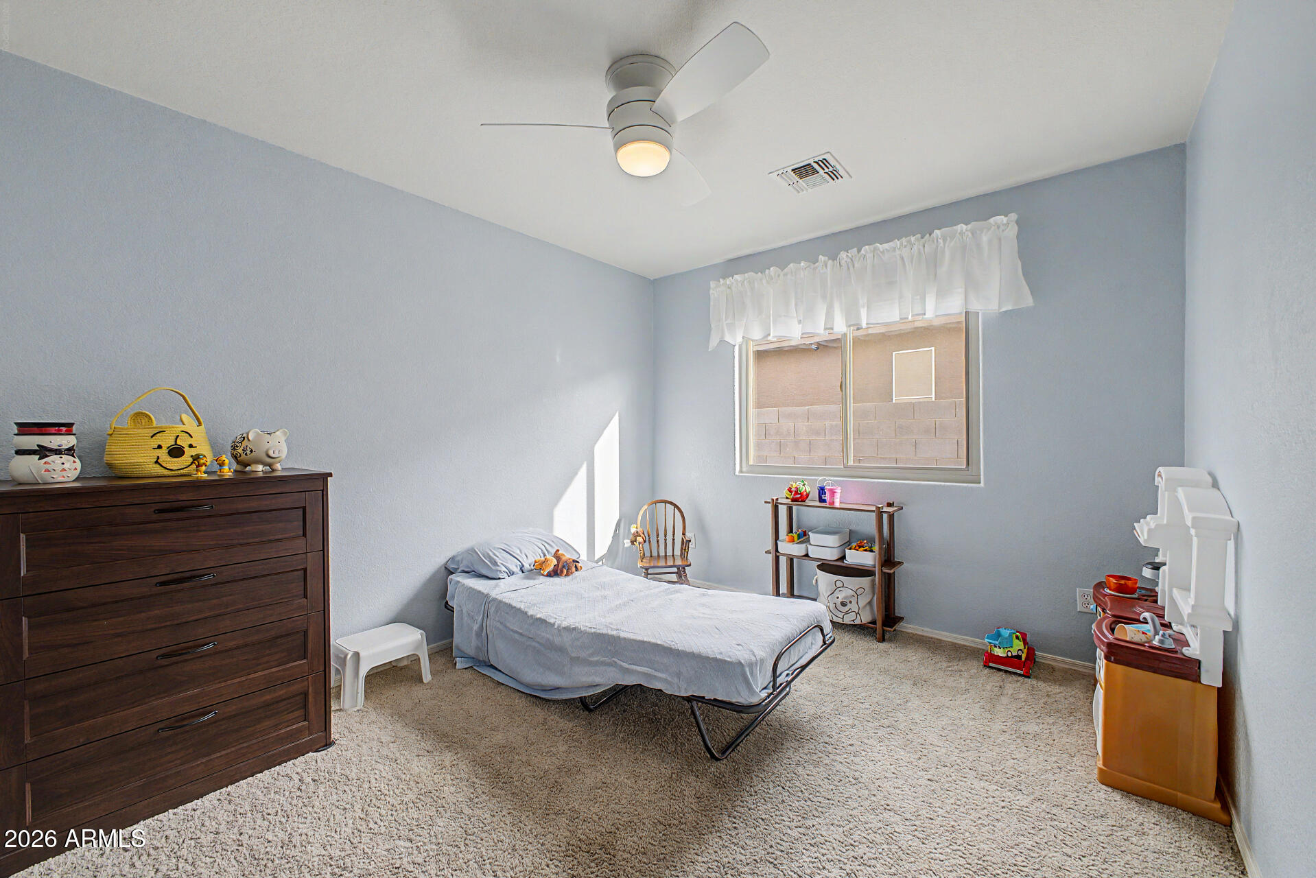 3425 South Loback Lane Gilbert, AZ 85297 - Photo 29 of 52 a bedroom with a bed and a window