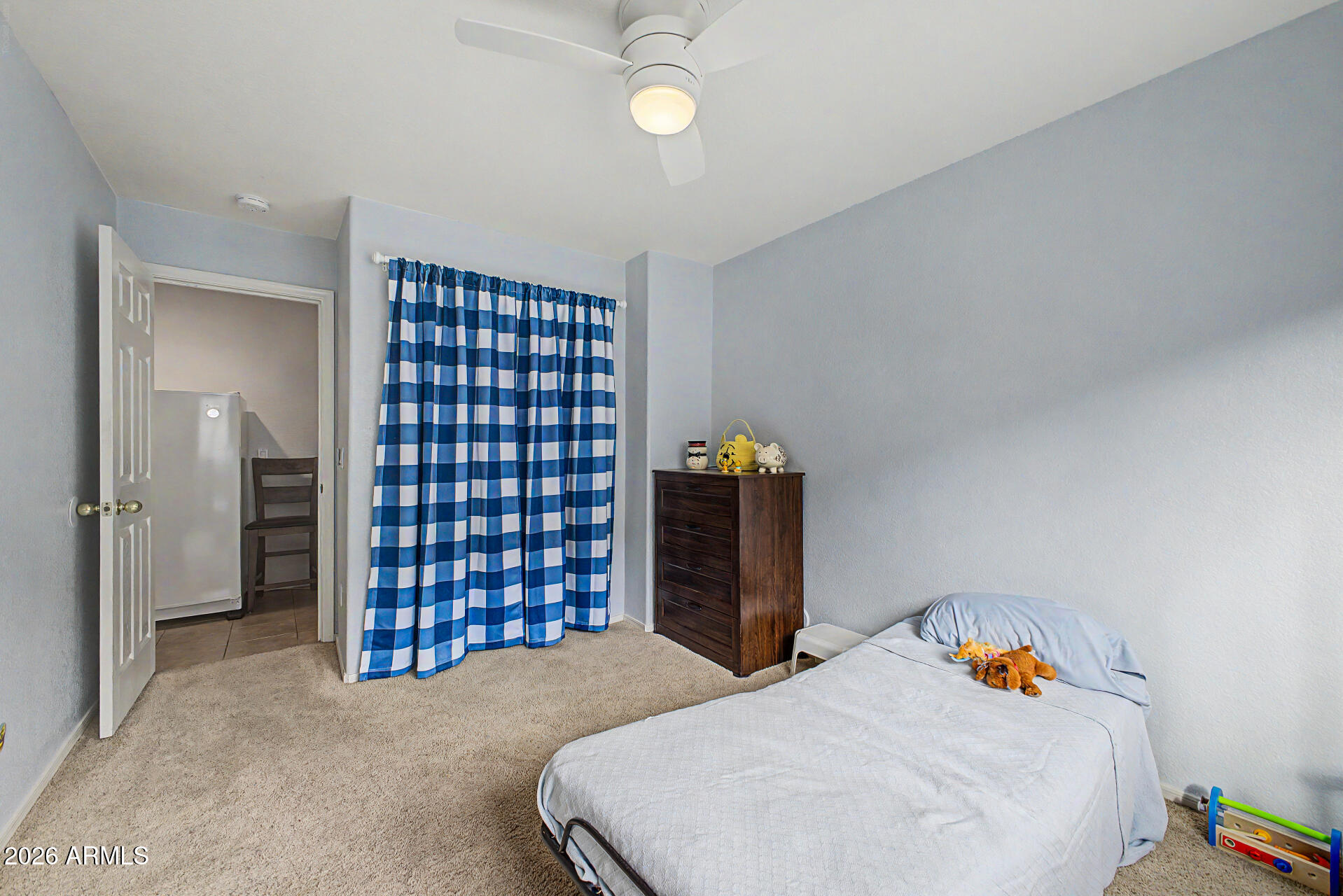 3425 South Loback Lane Gilbert, AZ 85297 - Photo 30 of 52 a bedroom with a bed and a chandelier