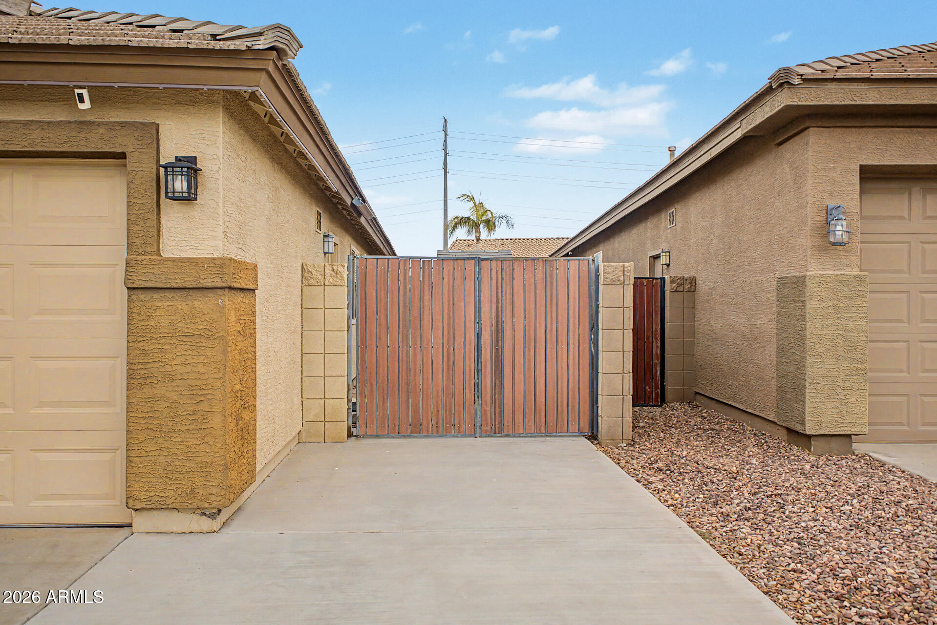 3425 South Loback Lane Gilbert, AZ 85297 - Photo 39 of 52 a view of a house with a wooden fence