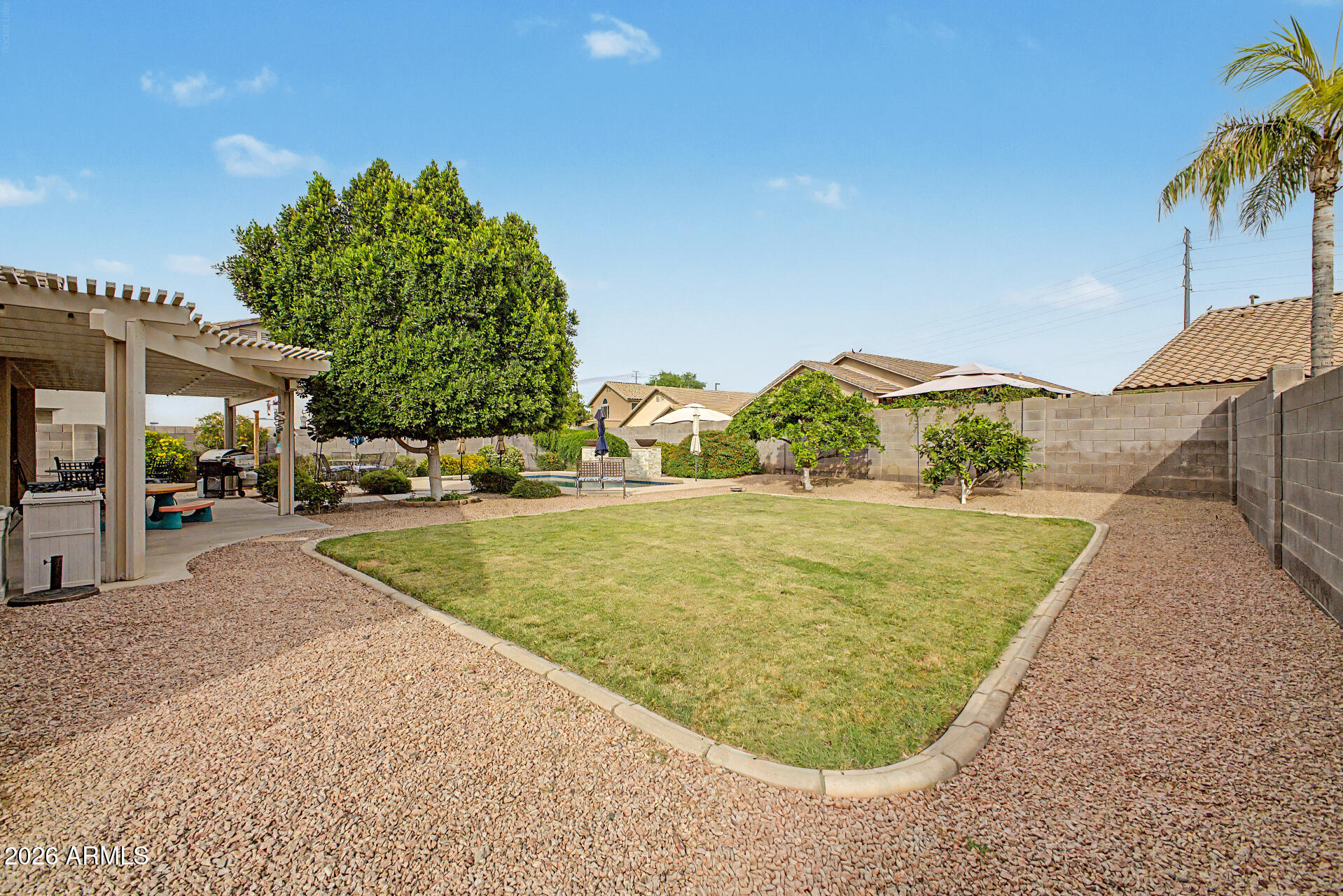 3425 South Loback Lane Gilbert, AZ 85297 - Photo 41 of 52 swimming pool view with a garden space