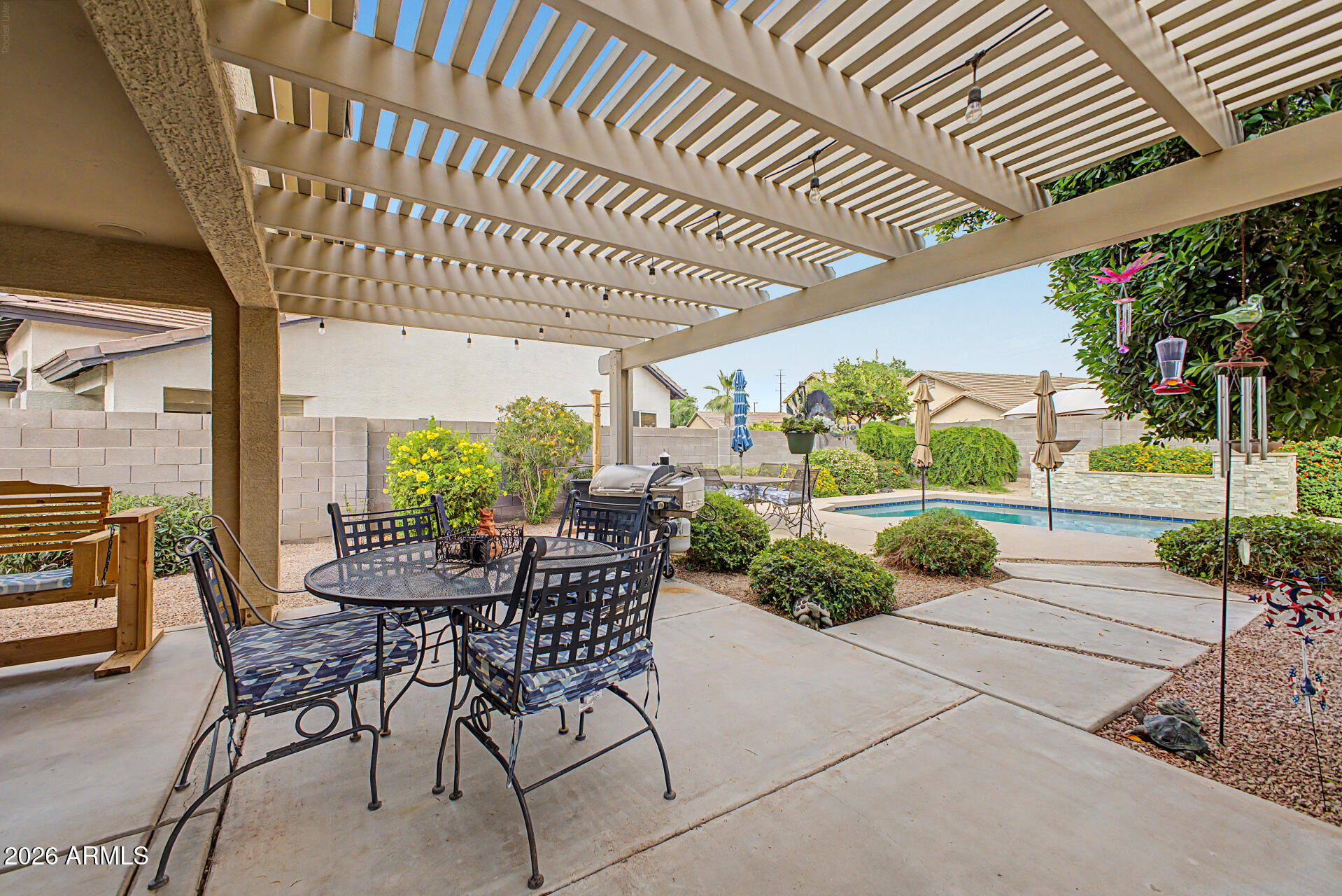 3425 South Loback Lane Gilbert, AZ 85297 - Photo 43 of 52 a view of a patio with a table and chairs