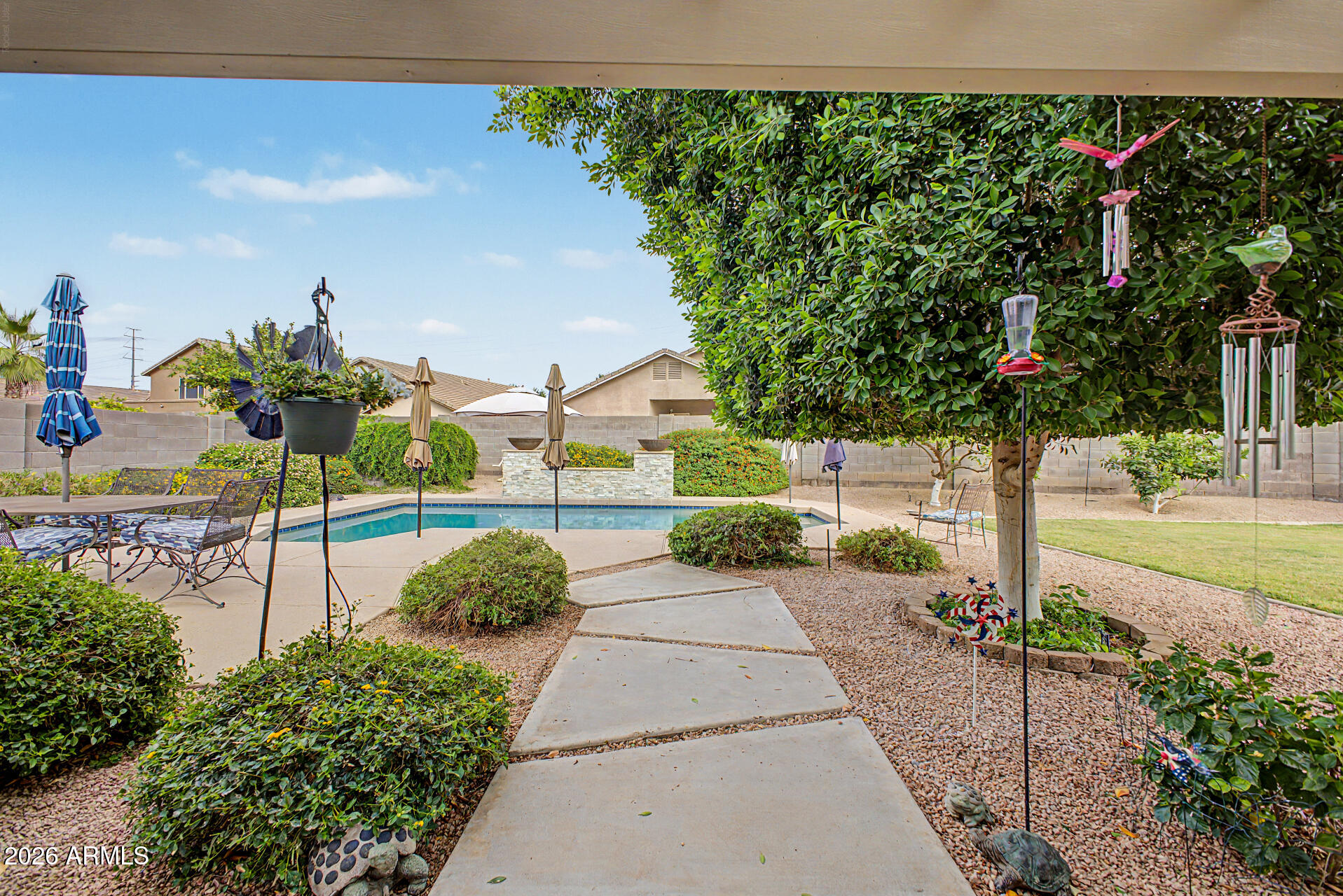 3425 South Loback Lane Gilbert, AZ 85297 - Photo 44 of 52 a sign board with yard in the back