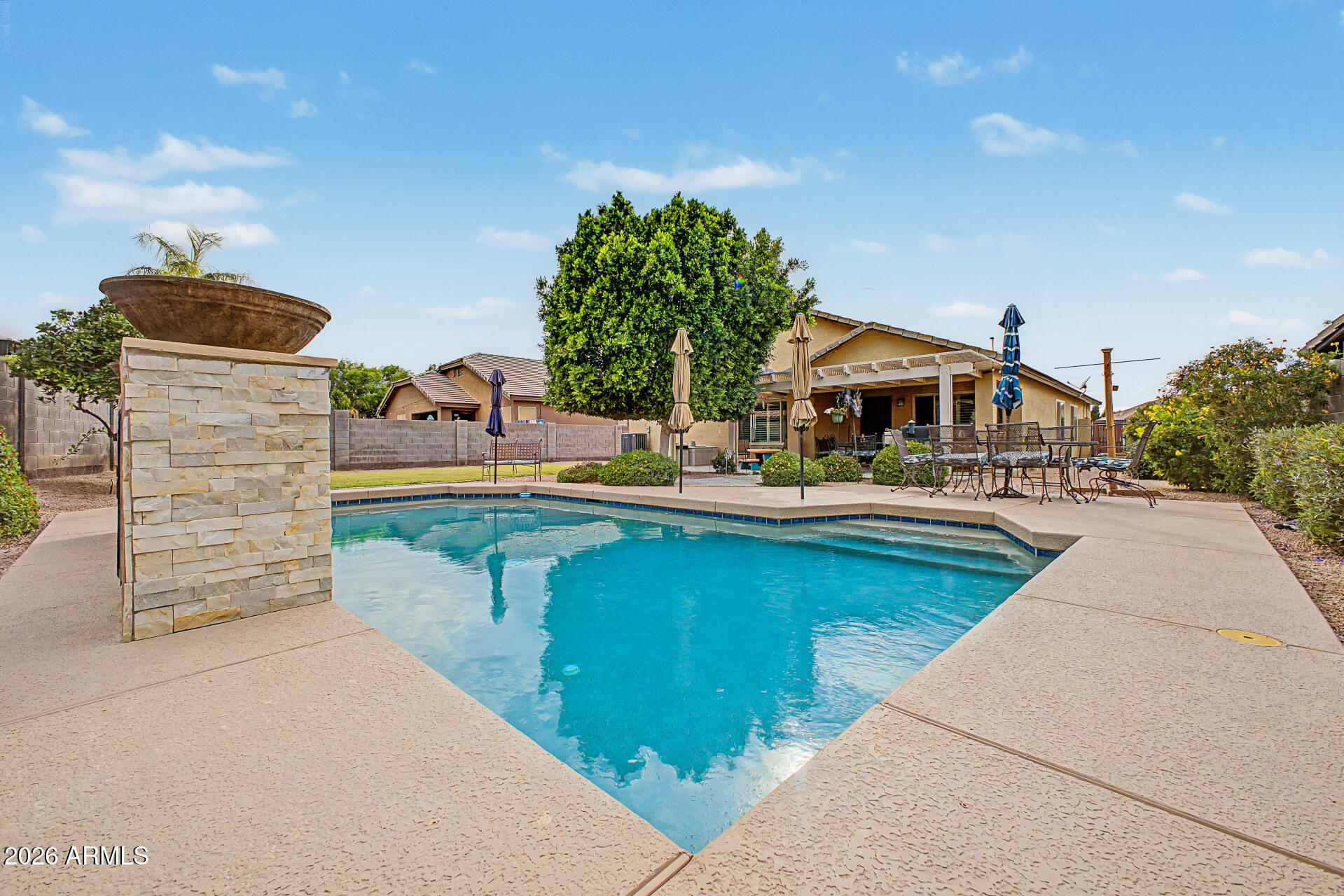 3425 South Loback Lane Gilbert, AZ 85297 - Photo 46 of 52 swimming pool view with a seating space and a garden view