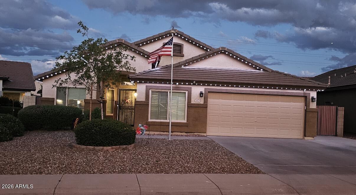 3425 South Loback Lane Gilbert, AZ 85297 - Photo 49 of 52 a front view of a house with garden