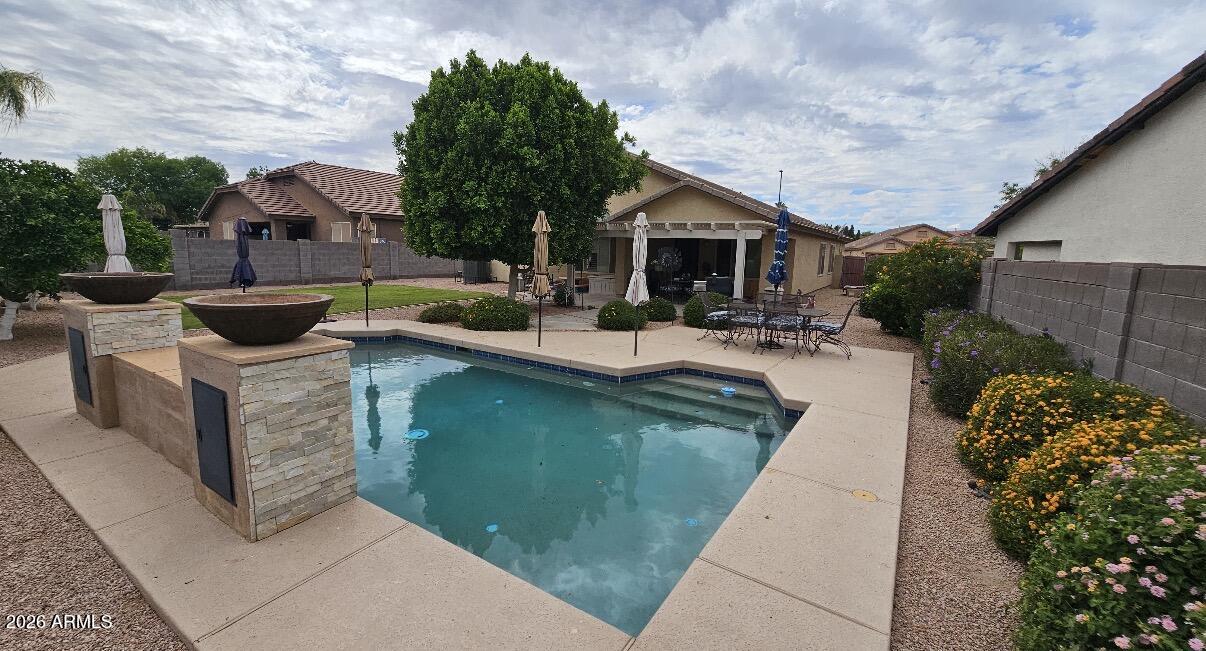 3425 South Loback Lane Gilbert, AZ 85297 - Photo 50 of 52 a front view of a house with sitting area
