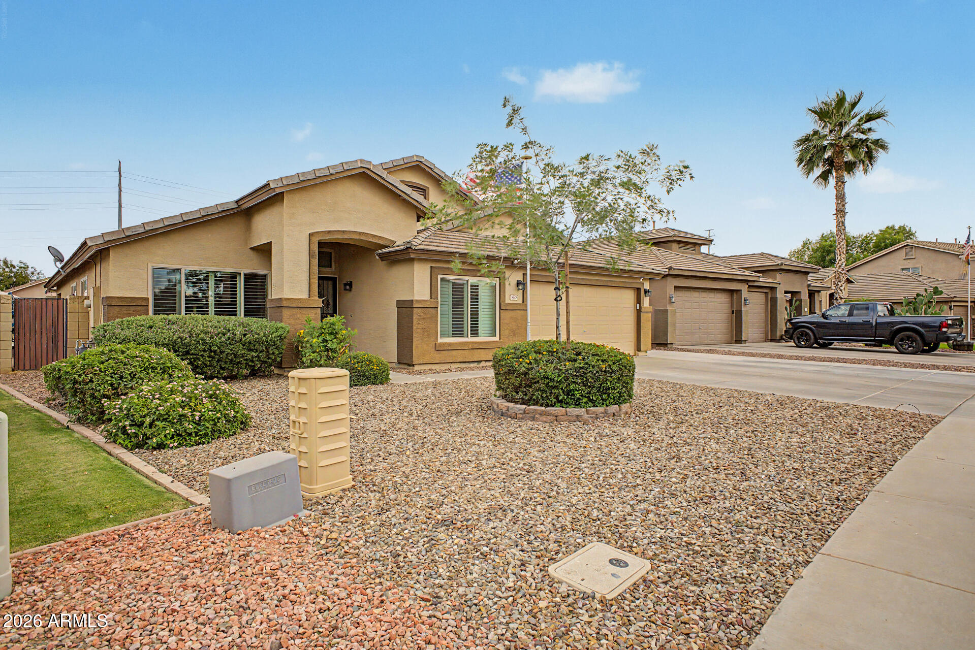 3425 South Loback Lane Gilbert, AZ 85297 - Photo 5 of 52 a view of a white house next to a yard