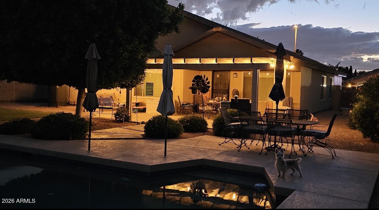 3425 South Loback Lane Gilbert, AZ 85297 - Photo 52 of 52 a view of a patio with a table chairs and a potted plant