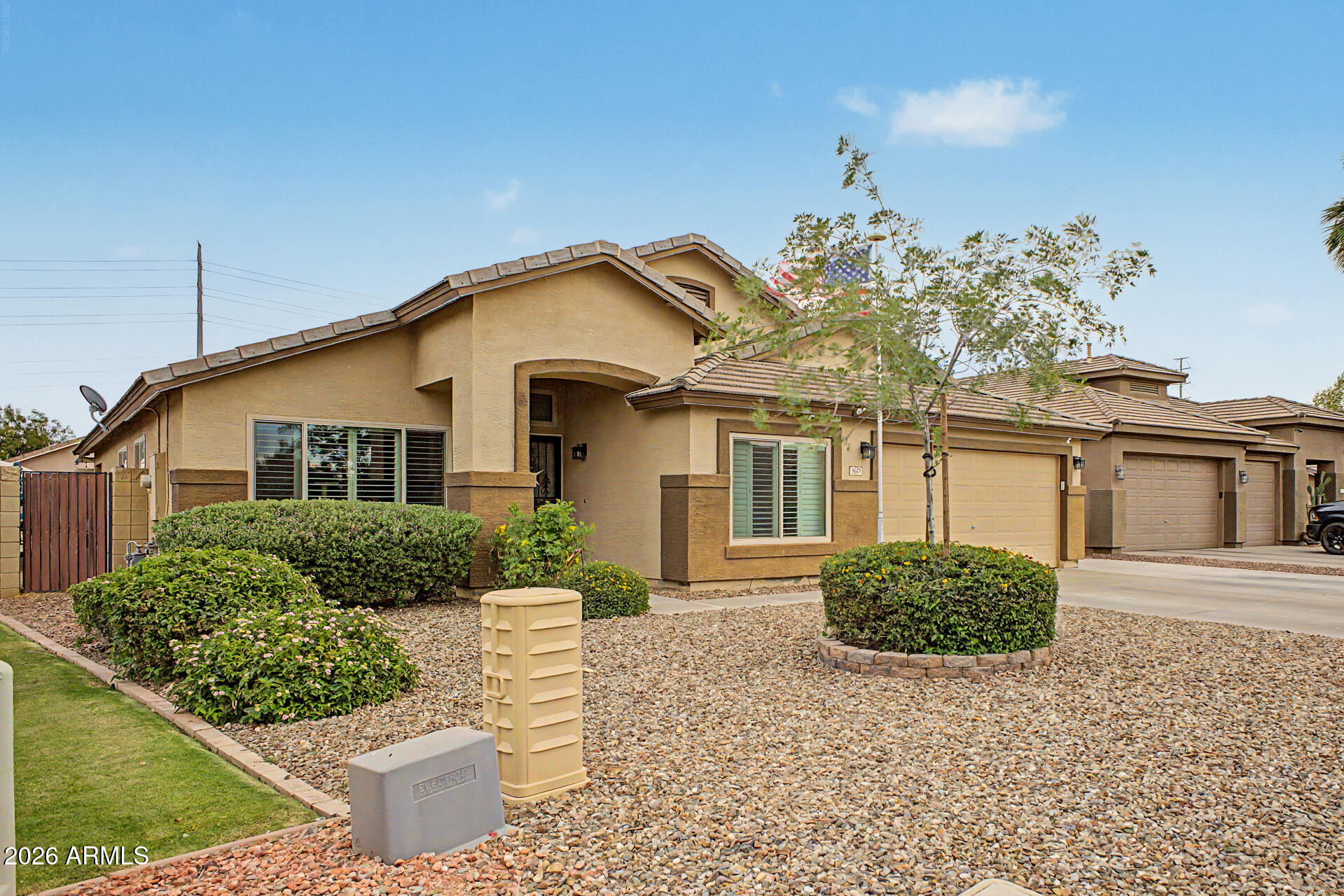 3425 South Loback Lane Gilbert, AZ 85297 - Photo 6 of 52 a front view of a house with a yard