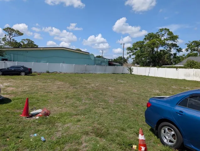 a view of a backyard with a table and plants