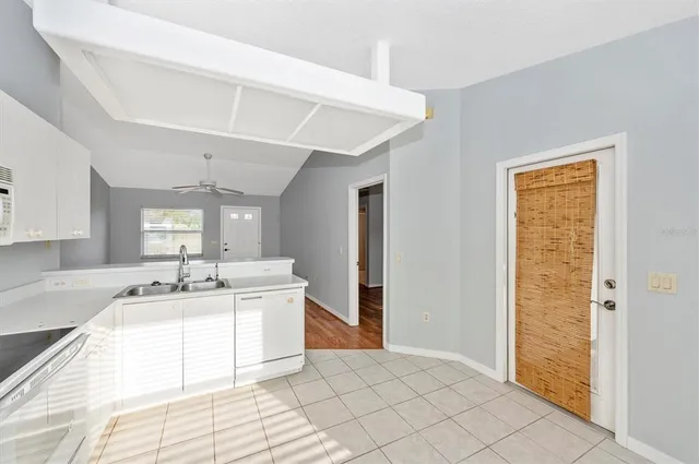 a spacious bathroom with a sink a mirror and a bath tub