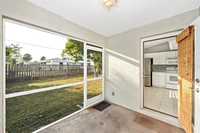 a view of a room with wooden floor and outdoor view