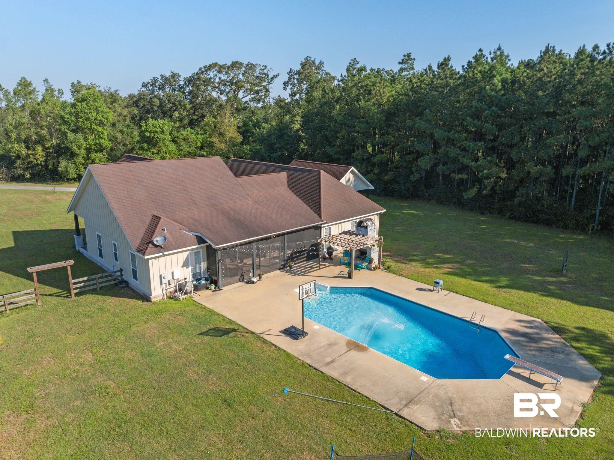 15635 North A N Brady Road Bay Minette, AL 36507 - Photo 42 of 51 View of pool featuring a diving board, a lawn, and a patio