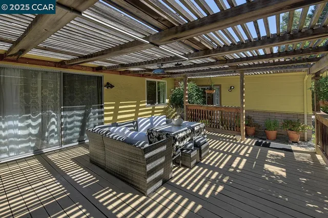 a view of outdoor space with wooden floor