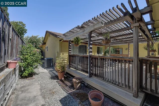 a view of a backyard with sitting area