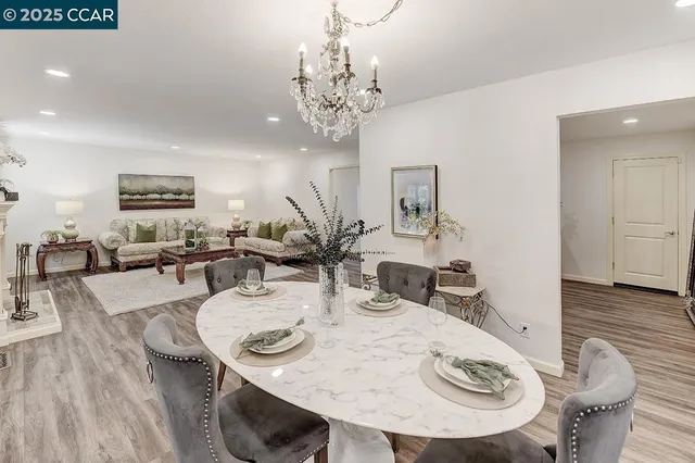 a bathroom with a granite countertop sink a toilet a mirror and shower