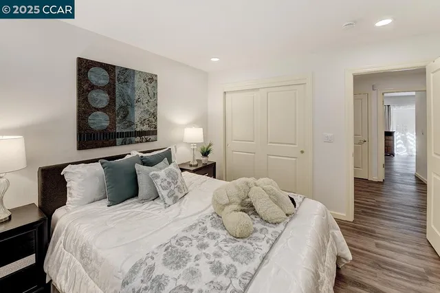 a bathroom with a granite countertop sink a toilet and shower