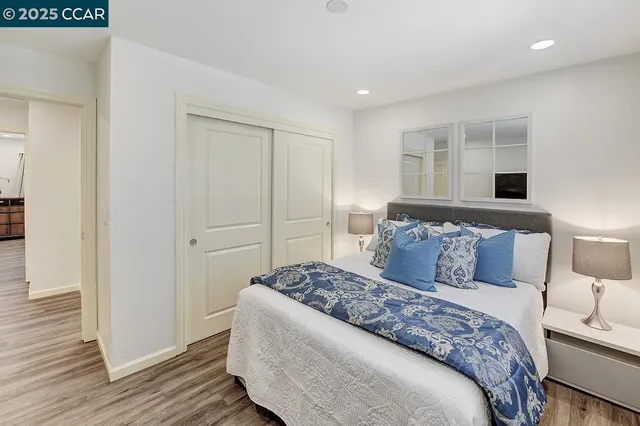 a utility room with dryer washer and a view of living room