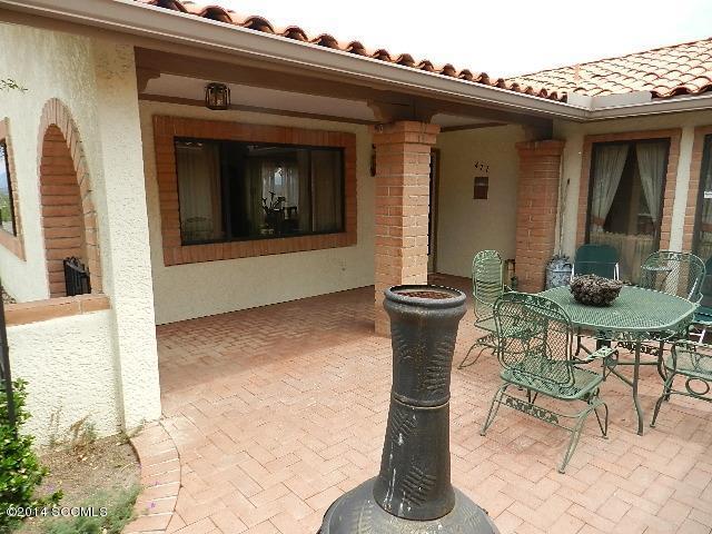 471 Camino Providencia Rio Rico, AZ 85648 - Photo 33 of 49 a view of a patio with table and chairs and potted plants