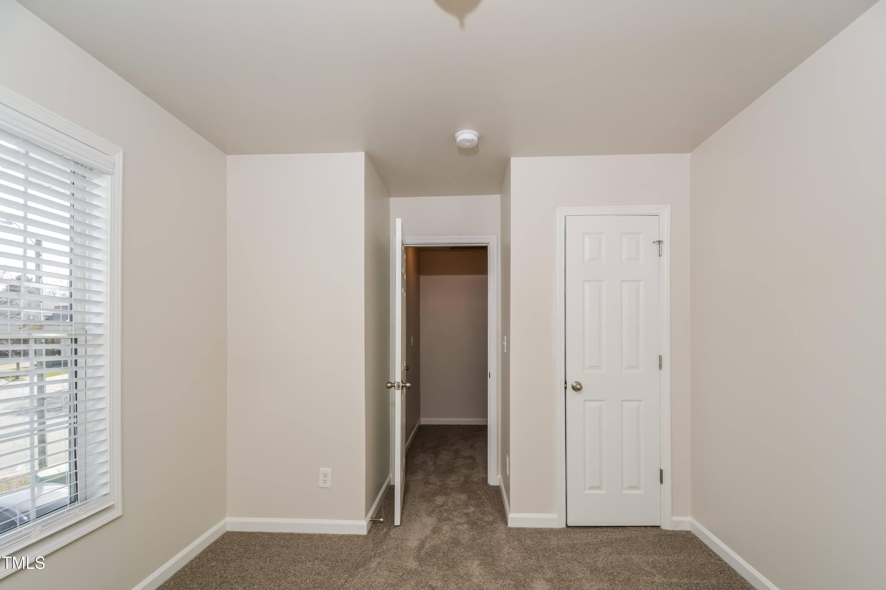 745 Southgate Drive Raleigh, NC 27610 - Photo 10 of 17 an empty room with windows and closet