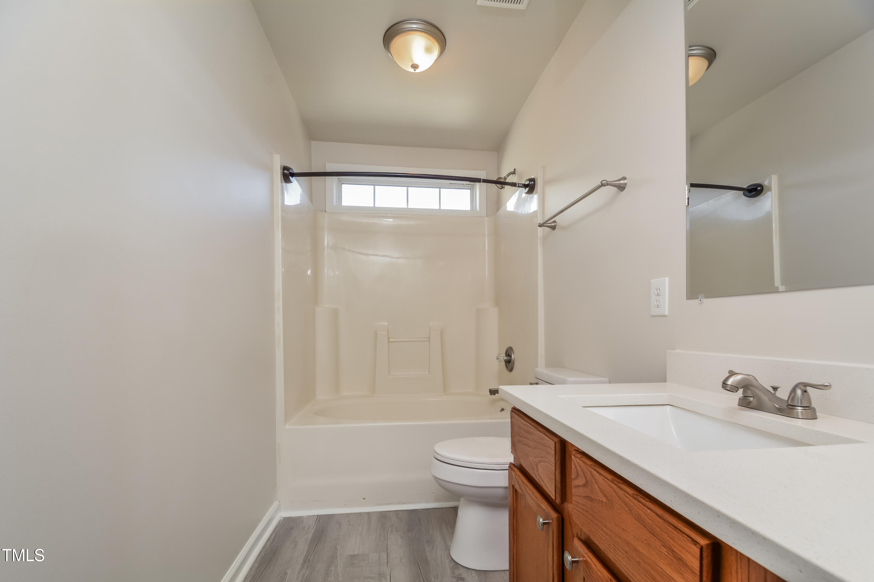 745 Southgate Drive Raleigh, NC 27610 - Photo 6 of 17 a bathroom with a sink a toilet and shower