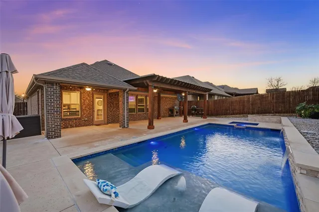 a view of a house with pool and wooden floor