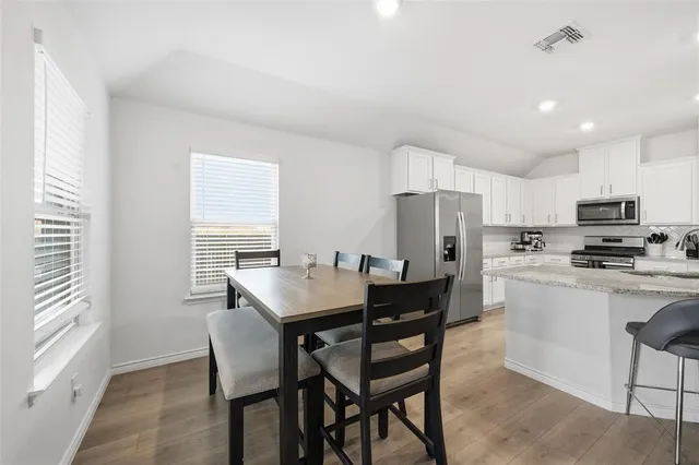 a view of a dining room with furniture