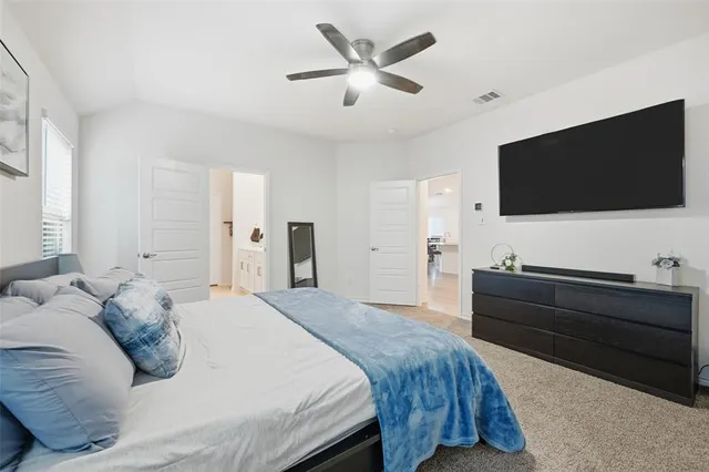a spacious bathroom with a double vanity sink a mirror and shower