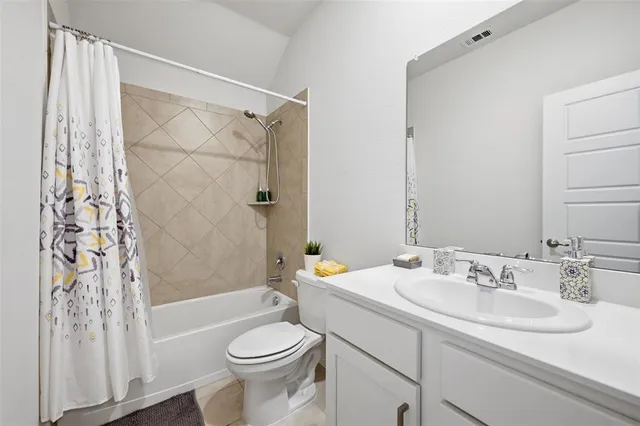 an aerial view of a house with a lake view