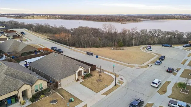 an aerial view of residential building and lake