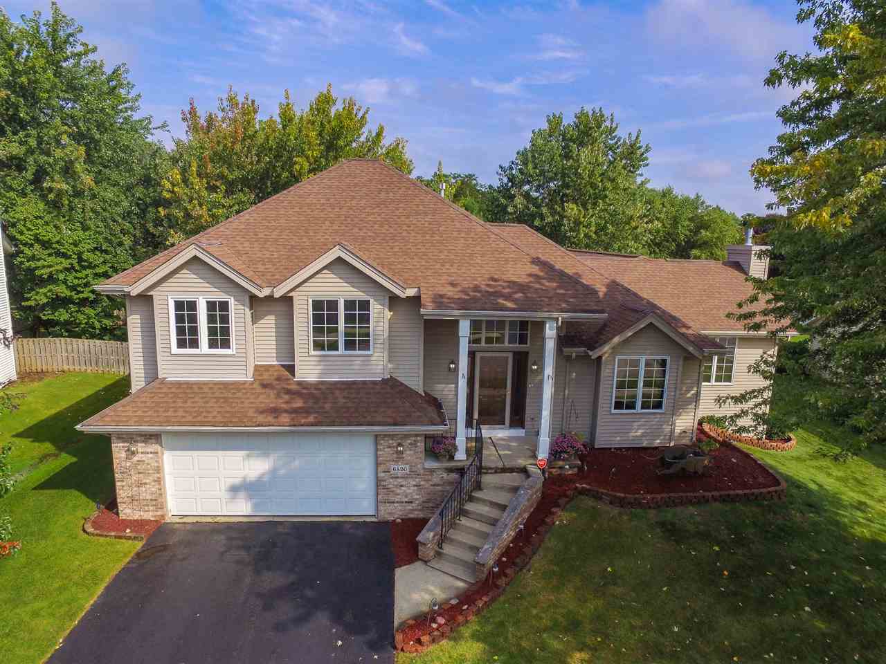 6820 Stone Cottage Road Rockford, IL 61114 - Photo 1 of 24 a aerial view of a house with a yard table and chairs