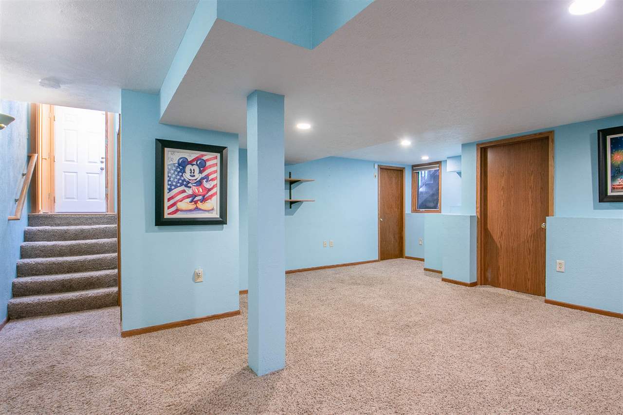 6820 Stone Cottage Road Rockford, IL 61114 - Photo 20 of 24 a view of an empty room with a fireplace