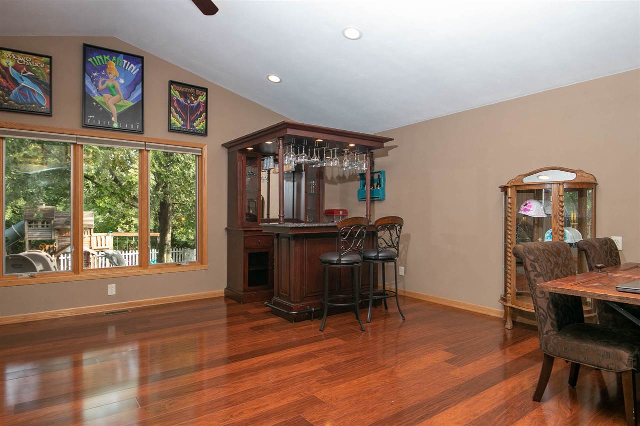 6820 Stone Cottage Road Rockford, IL 61114 - Photo 8 of 24 a view of a livingroom with furniture window and wooden floor