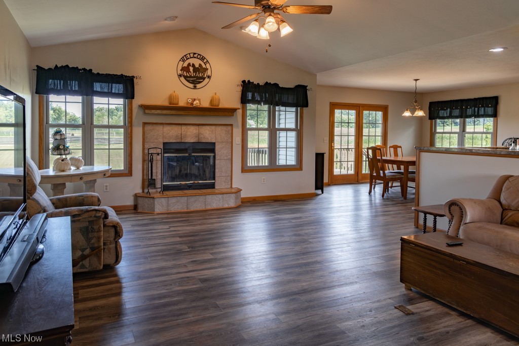 8383 Ickes Road Wooster, OH 44691 - Photo 14 of 32 Living room featuring plenty of natural light, dark hardwood flooring, ceiling fan, and a tile fireplace