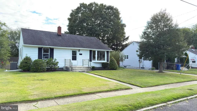 a view of a house with a swimming pool and a yard