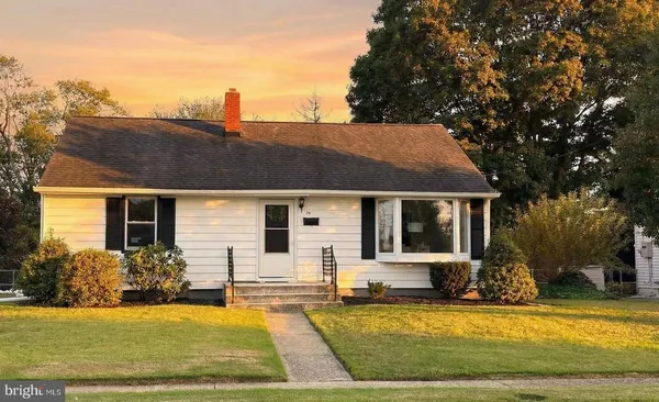 a view of a house with swimming pool and sitting area