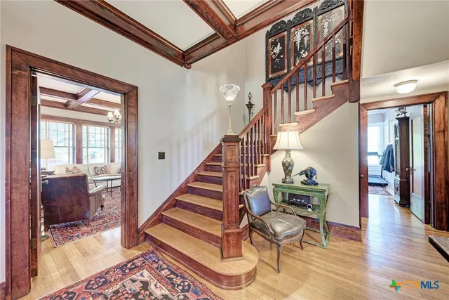 a view of entryway livingroom and hall with wooden floor