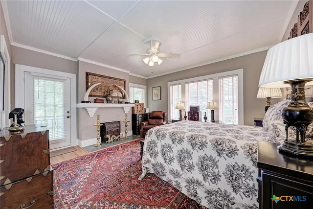 a bed room with a bed and a fireplace