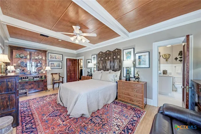 a bedroom with a large bed and a couch