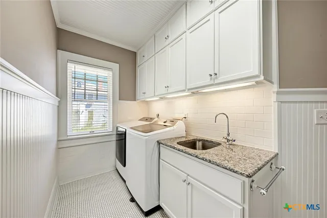 a kitchen with a sink and cabinets