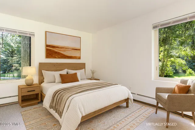 a kitchen with stainless steel appliances granite countertop a refrigerator a stove a sink and a refrigerator with wooden floor